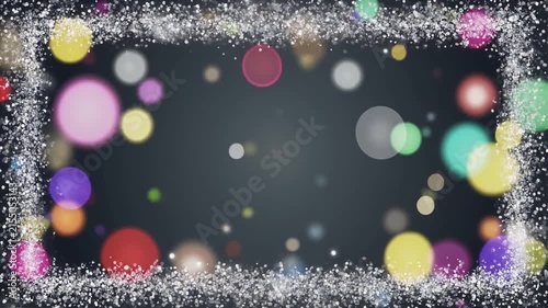 銀色の粒と多色の玉ボケが囲む背景　余白のある映像素材