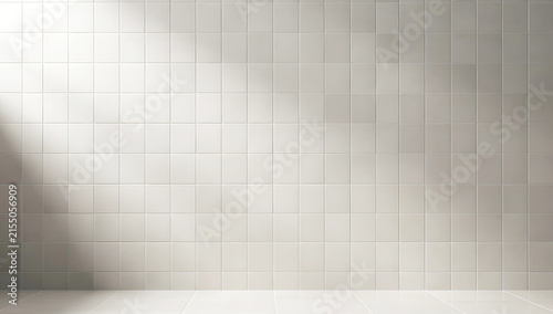 Clean white square ceramic tile wall background with soft diagonal sunlight ray for bathroom or kitchen product display