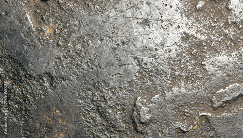 Scratched weathered silver metal plate texture with rough pitted surface and industrial metallic sheen