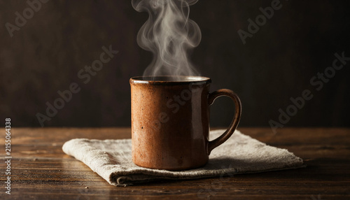 Hot beverage in ceramic mug with rising steam