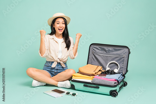 Traveler Ready With Packed Suitcase