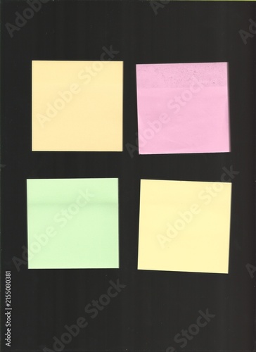 Four Colorful Sticky Notes on Dark Background