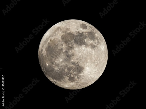 A high-detail, telephoto capture of a full moon centered against a deep black background, showcasing craters, lunar maria, and surface texture.
