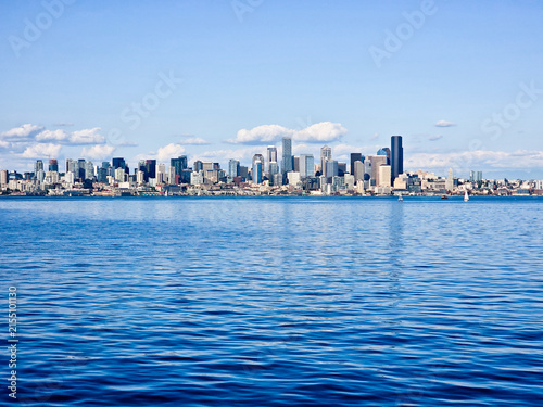 Принти на полотні Seattle downtown skyline across Elliott Bay with blue water and clear sky