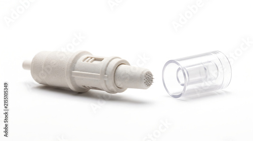  Sterile disposable microneedling needle cartridge tip with protective clear cap for aesthetic treatments. Professional medical cosmetic dermatology clinical component isolated on a clean white backgr