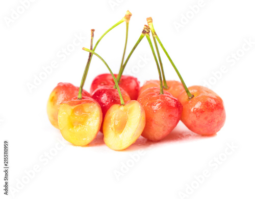 Fresh Sweet Cherries from Shandong Yantai China with Honey Citrine Colors Cut in Half Isolated on White Background