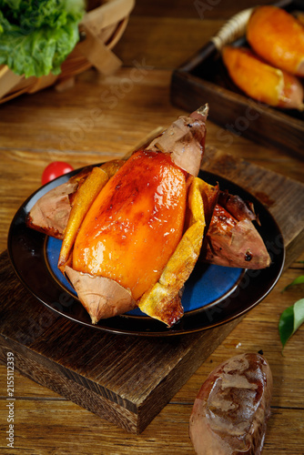 Baked Sweet Potatoes Shandong Style - Golden Orange Yummy Root Vegetables on Rustic Wooden Table
