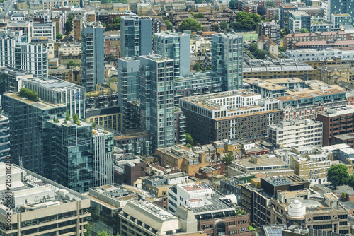 View of the modern London skyline featuring glass skyscrapers, historic brick buildings, and urban density in London, England, United Kingdom.