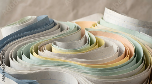 Swirling pastel colored paper strips in artistic arrangement