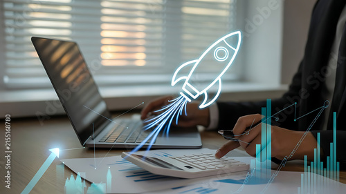 Businessman launching startup with digital growth charts and calculator on desk
