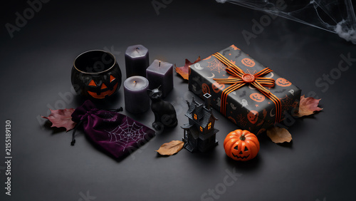 Halloween gift presentation with autumn leaves and glowing lanterns halloween decoration celebration atmospheric seasonal