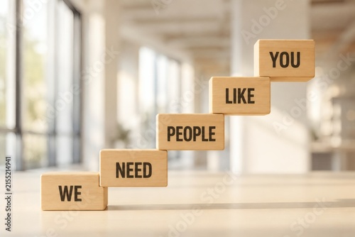 Stairway to Success: Wooden blocks ascend in a staircase formation, each inscribed with words that build a motivational message about business growth and customer relations.