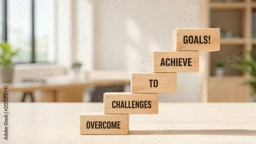 Steps to Success: Wooden blocks inscribed with OVERCOME CHALLENGES TO ACHIEVE GOALS! are stacked like stairs, symbolizing the journey to accomplishment and the power of perseverance.