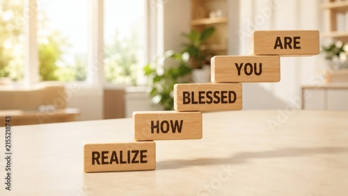 How You Realize Blessed: Wooden blocks with the inscription Realize How Blessed You Are ascend in a staircase formation, symbolizing personal growth and gratitude.