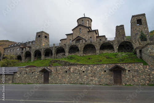 Alania Assumption Monastery on a cloudy October evening. Hidikus. North Ossetia-Alania, Russian Federation