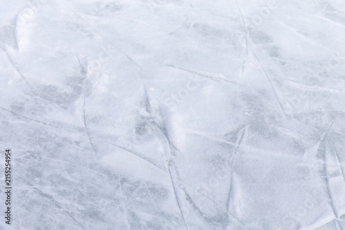 Canvas Print Ice background with marks from skating and hockey, blue texture of rink surface