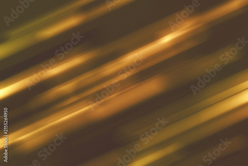 Abstract Blurred brown background with golden light