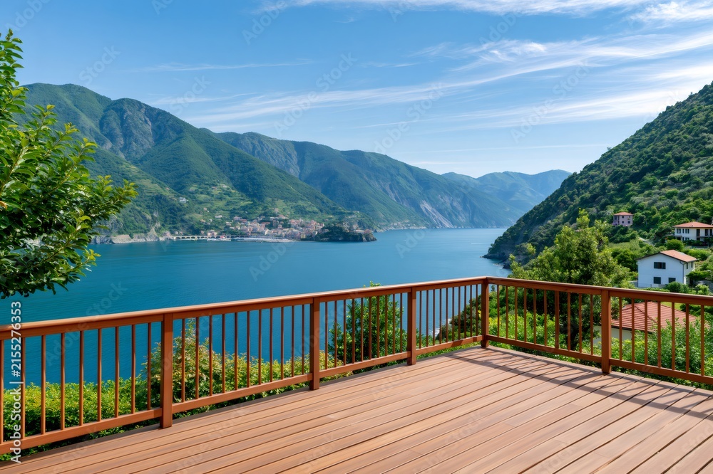 Fototapeta premium Wood deck overlooking a beautiful lake and mountains