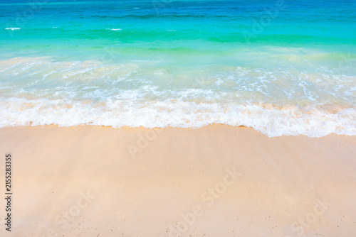 Nature of the ocean and blue sky Summer with sunshine, sandy beaches, clear blue waters sparkling against the blue sky. on an island with good ecology and environment Background for summer vacation	