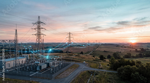 Smart Grid Power Substation with Digital Energy Network and High Voltage Transmission Lines at Sunset