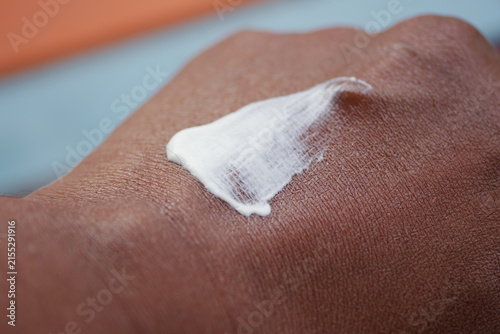 Canvas Print Cream applied on a hand in a close-up view
