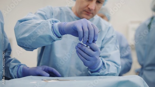 Surgeon preparing medical procedure with tools in operating room operation procedure hospital clinical