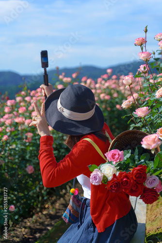 Rose Garden Asian Woman Enjoying Colorful Flowers with Mountain Landscape in Chiang Mai, Northern Thailand