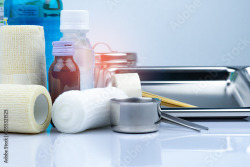 Принти на полотні Wound care dressing set and stainless steel plate, forceps, iodine cup, conform bandage, elastic cohesive retention bandage, antiseptic and normal saline bottle, instruments container