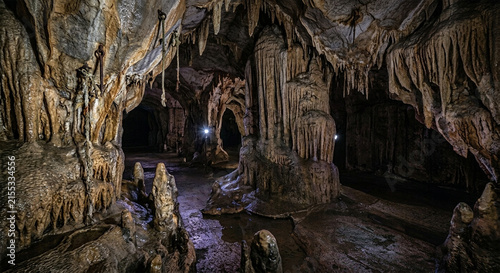 Underground Limestone Cave Interior with Stalactites Stalagmites and Dramatic Lighting