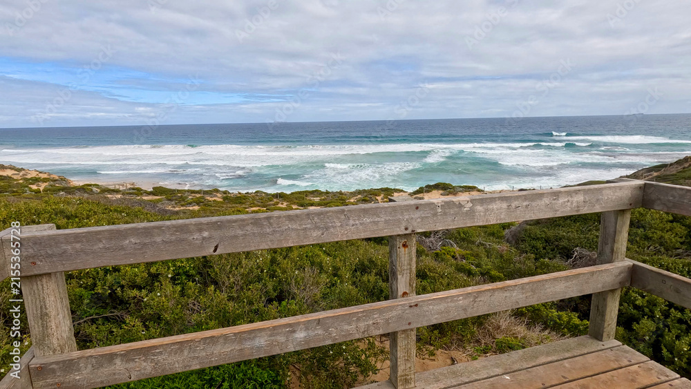 Fototapeta premium Ocean Waves Viewed from a Wooden Lookout Platform in Rye