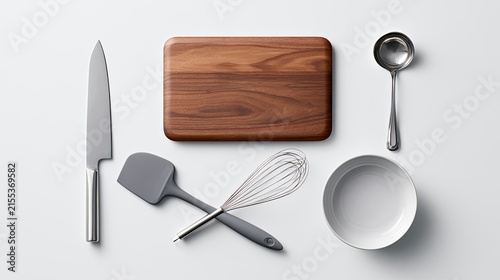 Overhead View of Essential Kitchen Utensils and Cutting Board.