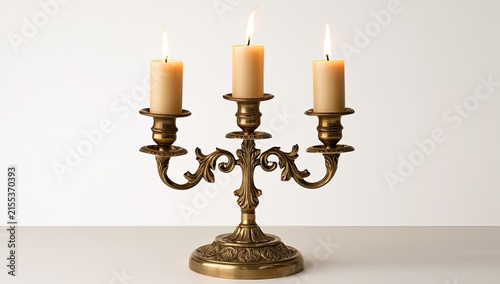 Antique Brass Candelabra with Three Lit Candles.