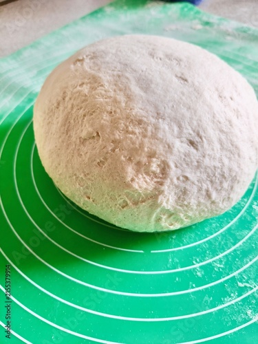 Obraz na plátne Homemade Dough Being Shaped on a Silicone Baking Mat