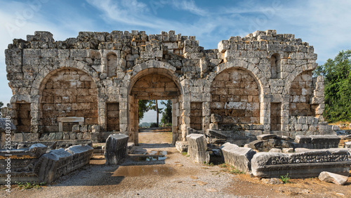 Late Roman Gate ruins at the ancient site of Perge in Antalya, Turkey, featuring stone arches and historical architecture from the Roman period
