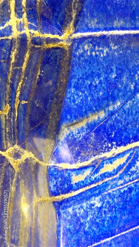 Obraz na plátne Closeup of polished blue lapis lazuli stone with gold pyrite veining, layered mi