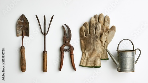 Collection of Gardening Tools and Accessories Laid Out on a White Background.
