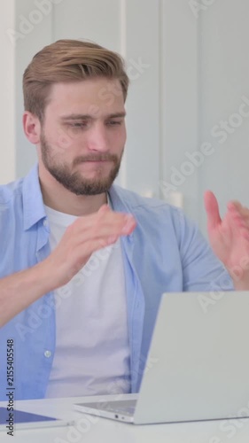Young Creative Man with Laptop having Loss, Failure , Vertical Video