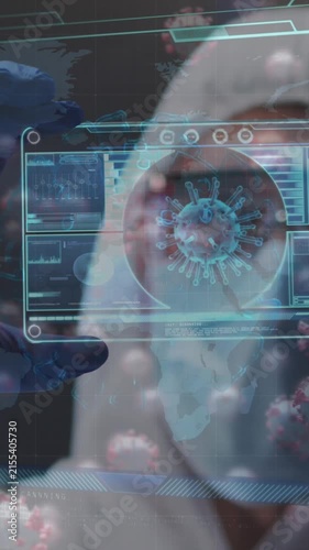 Animation of covid 19 cells, scientist in ppe suit holding screen with covid 19 cell and data