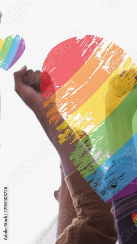 Animation of rainbow hearts over hands diverse protesters