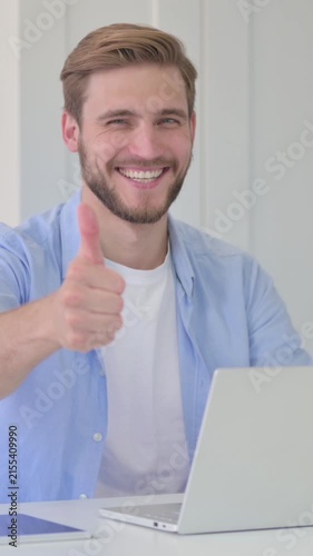 Thumbs Up by Young Creative Man with Laptop at Work, Vertical Video