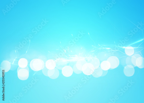Abstract background of light blue shades with glare and bokeh effect.