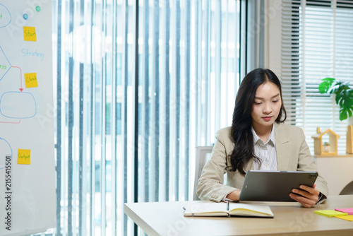 young woman using pad computer for business app. Busy executive CEO businesswoman professional holding digital tablet pc device for work in office workplace. Web banner, copy space