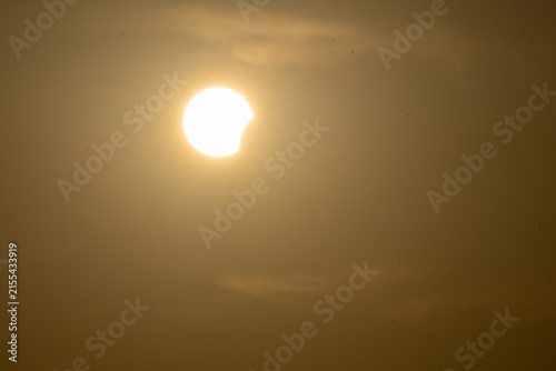 solar eclipse the moon obscures the sun sunset in the mountains