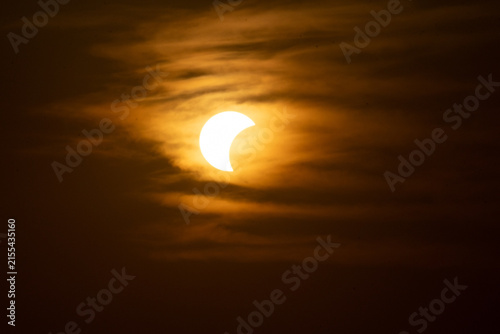 solar eclipse the moon obscures the sun sunset in the mountains