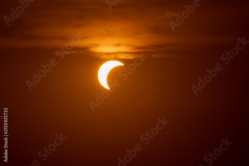 solar eclipse the moon obscures the sun sunset in the mountains