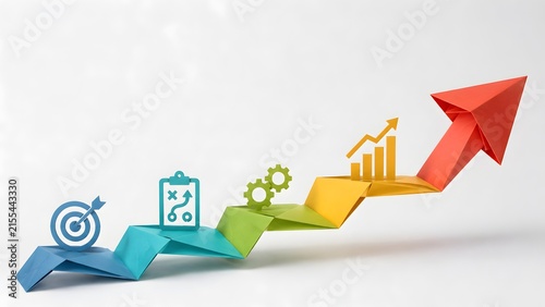Colorful origami paper arrow ascending with business strategy and growth icons on a white background.