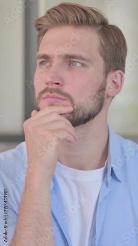 Portrait of Pensive Young Creative Man Thinking, Vertical Video