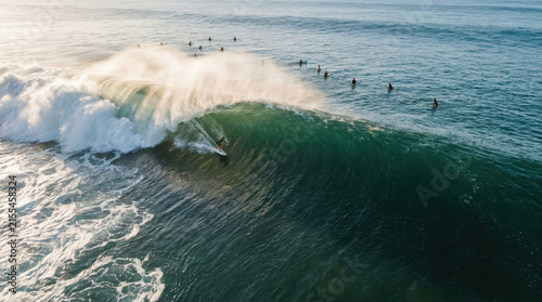 Surfing ocean wave surfer water sport sea adventure summer outdoors powerful ocean wave with surfer riding crest as spray catches sunlight while other surfer wait lineup, dynamic seascape energy