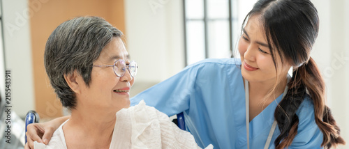 Fotografie Doctor or nurse to encourage a patient, hospitalization for illness, assisting a patient, resting, feeling discouraged