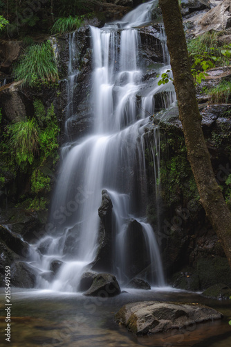 Close view of a cascading forest waterfall in Portugal
